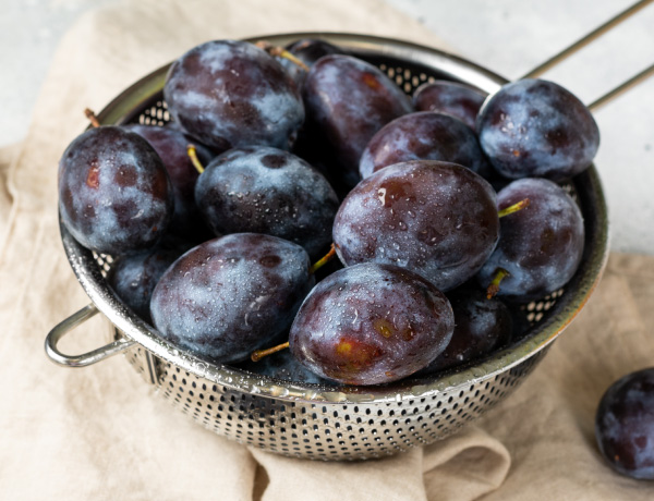 plums in a colander